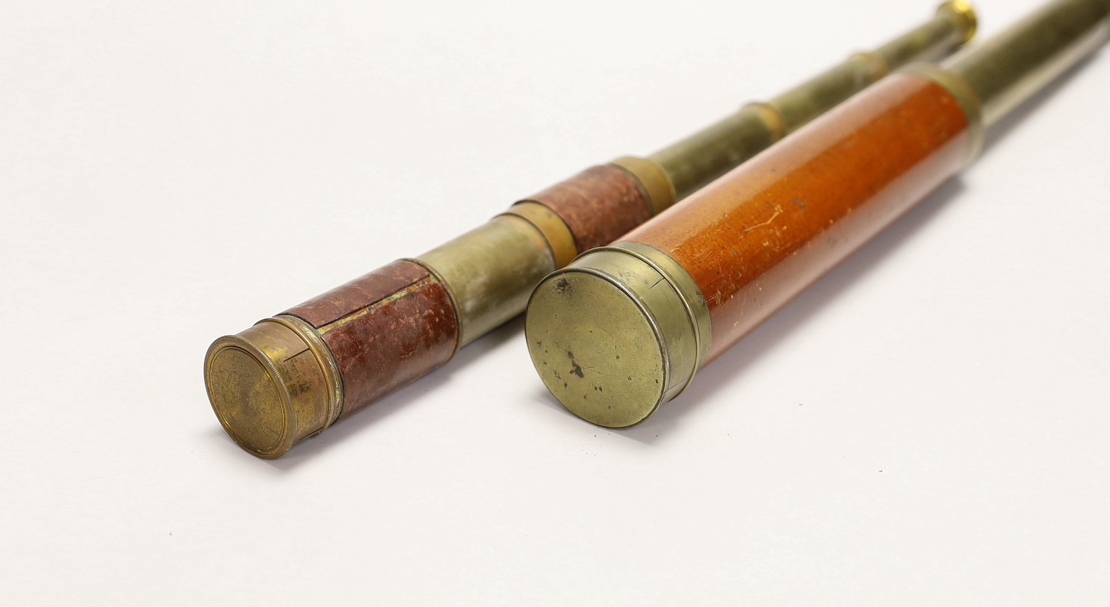 A cased set of draughtsman's instruments and two small telescopes